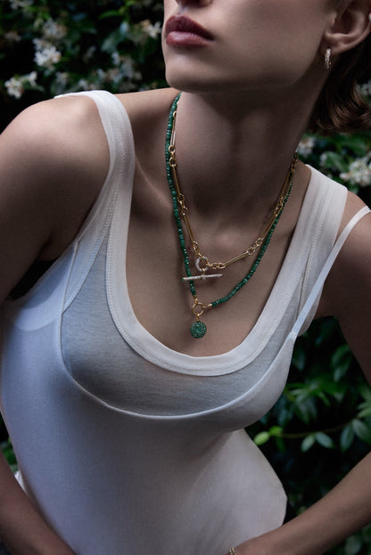 Lucy Delius emerald polished 14ct gold necklace, side angle view