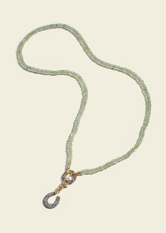Lucy Delius polished 14ct gold necklace, worn on model